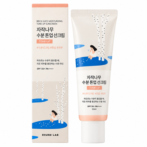 Round Lab Birch Juice Tone-Up Sonnencreme als beige Tube mit pfirsichfarbenem Rand neben der Faltschachtel
